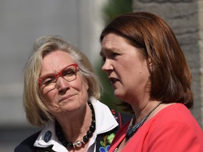 Carolyn Bennett (left), minister of Crown-Indigenous relations and northern affairs looks on as Indigenous Services Minister Jane Philpott speaks to media after a Liberal cabinet shuffle at Rideau Hall in Ottawa on Monday, Aug. 28, 2017. With the division of INAC, presumably it will become easier for the negotiating department to focus on signing an increased number of self-governing arrangements with more bands under the Indian Act, Joseph Quesnel writes.