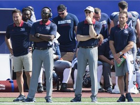 Alouettes head coach and general manager Kavis Reed, second left, looks on from the bench against the Ottawa Redblacks in Montreal on Sunday, Sept. 17, 2017.