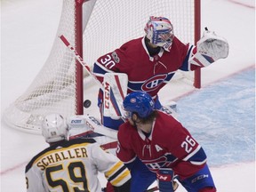 Boston Bruins forward Tim Schaller (59) scores a goal against Montreal Canadiens goalie Zachary Fucale as defenceman Jeff Petry defends during second period action of an NHL preseason game Monday, September 18, 2017 at the Videotron Centre in Quebec City.