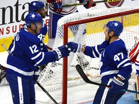 Toronto Maple Leafs' Patrick Marleau, left, and Leo Komarov, of Finland, celebrate Marleau's goal against the Montreal Canadiens during the second period of their NHL preseason hockey game in Toronto on Monday September 25, 2017.