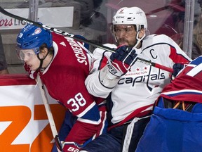 Washington Capitals' Alex Ovechkin gets caught in between Montreal Canadiens' Nikita Scherbak, left, and Andreas Martinsen during third period NHL pre-season hockey action Wednesday, September 20, 2017 in Montreal.
