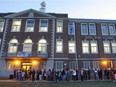 People line up for an open house at Royal West Academy in Montreal West  on Oct. 7, 2008. Grade 6 students seeking admission to elite public high schools or private schools for Secondary 1 generally are required to write entrance exams.
