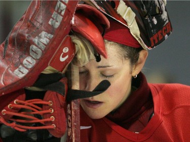 A despondent Charline Labonté bows her head into her hands after her team, the McGill Marlets, lost the CIS championship 4-0 to Alberta Pandas on March 19, 2007.