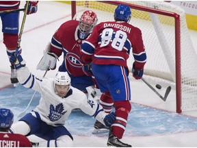 Toronto Maple Leafs' Andreas Johnsson, bottom left, celebrates scoring against Montreal Canadiens goalie Carey Price while Brandon Davidson looks inside the net, during third period NHL pre-season action Wednesday, September 27, 2017, in Quebec City.
