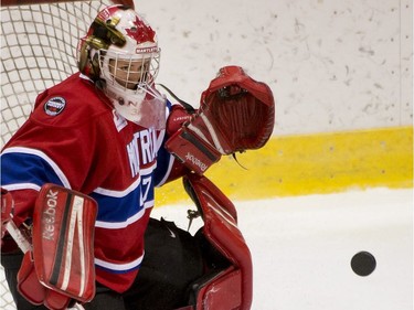 Goalie Charline Labonté of the Montreal Stars has her eyes on the puck during a Canadian Women's Hockey League game at the Etienne Desmarteaux arena in Montreal on Nov. 17, 2012.