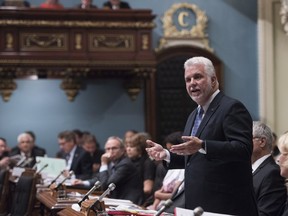 Quebec Premier Philippe Couillard responds to the Oppositio during question period, Tuesday, September 19, 2017 at the legislature in Quebec City.