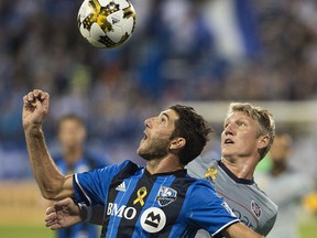 Montreal Impact's Ignacio Piatti, left, and Chicago Fire's Bastian Schweinsteiger challenge for the ball during the first half of MLS soccer action in Montreal, Saturday, Sept. 2, 2017.
