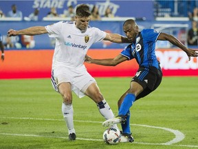Montreal Impact's Anthony Jackson-Hamel, right, challenges Real Salt Lake's David Horst during second half MLS soccer action in Montreal, Saturday, August 19, 2017.