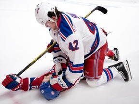 New York Rangers defenceman Brendan Smith pushes Montreal Canadiens centre Andrew Shaw's head into the ice during first round NHL playoff action at the Bell Centre in Montreal on Wednesday April 12, 2017.