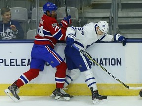 Leafs rookie Vladimir Bobylev battles for the puck against Canadiens' Jarret Tyszka during rookie camp at the Ricoh Coliseum in Toronto on Friday, Sept. 8, 2017.