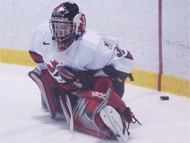 Goaltender Charline Labonté, 21, streches in a pre-game warmup of the first of a three under-22 Canada vs. United States womens hockey at the Sportsplex in Pierrefonds on Aug. 20, 2003.