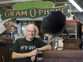 Co-founder of the Emile Berliner Musée des Ondes, Jean Bélisle poses next to a 1902 gramophone at the museum in Montreal, Wednesday, Aug. 16, 2017.