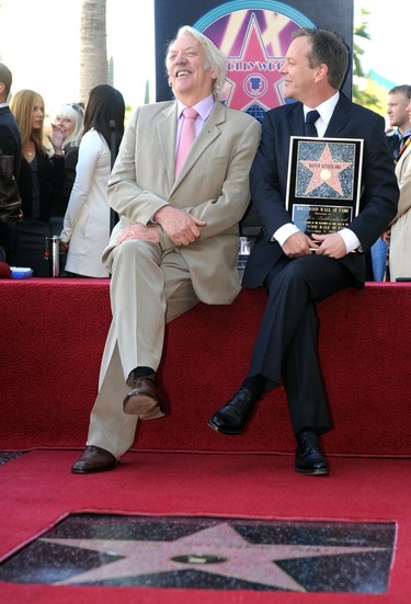 Kiefer Sutherland, right, with his father, actor Donald Sutherland, after getting the 2,377th Star on the Hollywood Walk of Fame in 2008 in Hollywood, California. (GABRIEL BOUYS/AFP/Getty Images)
