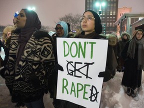 Protesters hold up signs in support of sexual assault survivors during a demonstration against rape culture in Place Emilie Gamelin in Montreal, Feb. 15, 2017.