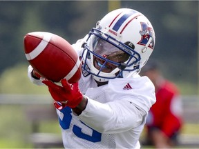 Alouettes receiver T.J. Graham, who is expected to get a second look against the Eskimos on Monday, reaches for the football during training camp at Bishops University in Lennoxville on May 29, 2017.