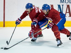 Montreal Canadiens left wing Max Pacioretty, left, and Montreal Canadiens defenseman Shea Weber battle for the puck during a training camp session at the Bell Sports Complex in Montreal on Friday September 15, 2017.