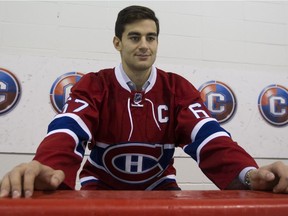 New Montreal Canadiens team captain Max Pacioretty sits on the bench at the Bell Sports Complex in Brossard near Montreal Friday, September 18, 2015.