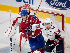 Washington Capitals Colby Williams crowds Montreal Canadiens' Max Pacioretty in front of goalie Pheonix Copley during preseason NHL play at the Bell Centre in Montreal on Wednesday September 20, 2017.