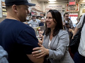 Valérie Plante greets diners at Schwartz’s deli in Montreal. “She cares profoundly about human beings, where people come from, who they are,” says one childhood friend.