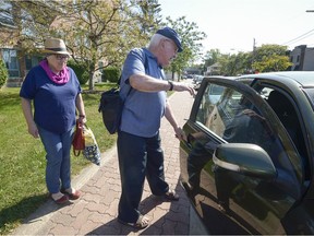 ABOVAS volunteer Malcolm Johnson opens his car door for a client before he drives her to a doctor's appointment last month. ABOVAS, a non-profit organization, offers accompanied-transport for West Islanders going to medical appointments. Call 514-694-3838 or check abovas.com.
