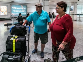 Dave and Doreen Tidbury, of Maitland, Ont., just returned from Las Vegas at Trudeau Airport in Dorval, on Monday, Oct. 2, 2017. The couple were at the MGM Grand, just 2km from the Mandalay Bay, the scene of the worst shooting in American history took place.