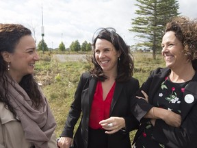 Projet Montreal leader Valerie Plante, centre, flanked by candidates Irina Maria Grecu, left, and Sue Montgomery laughs following a press conference, to discuss the party's plans for the former Hippodrome site in Montreal on Thursday, Oct. 5, 2017.