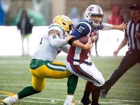 Edmonton Eskimos defensive-end Odell Willis sacks Montreal Alouettes' Drew Willy during CFL action in Montreal on Oct. 9, 2017.