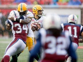Alouettes linebackers Kyries Hebert, 34, and Chip Cox, seen rushing Eskimos quarterback Mike Reilly on Monday. Both veterans are staying with Montreal.