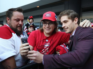 Montreal Canadiens' Brandon Davidson, right, gets his picture taken with Dawson Kremer outside the Bell Centre, prior to the game against the Chicago Blackhawks on Tuesday October 10, 2017.