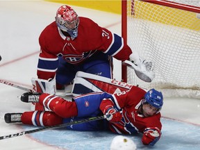 Montreal Canadiens' Brandon Davidson slides through crease in front of goalie Carey Price during third period NHL action in Montreal on Tuesday October 10, 2017.