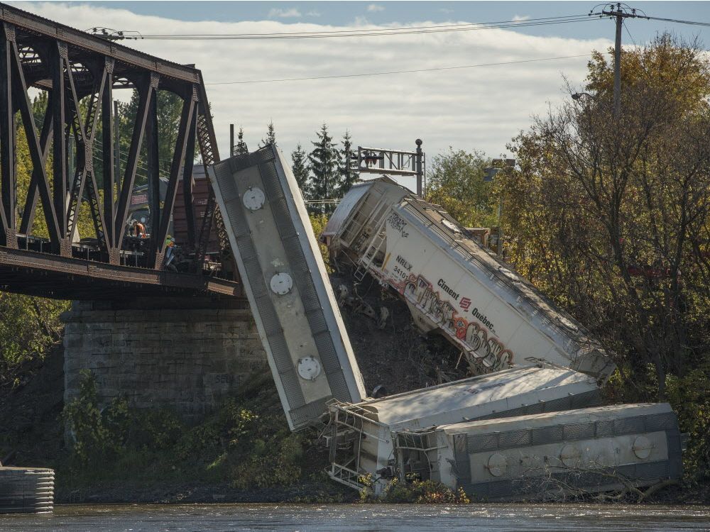 Train derails on Rivière des Mille Îles bridge Montreal Gazette