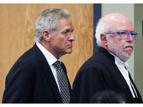 Antonio Accurso follows his lawyer Marc Labelle to court for opening statements at his trial for collusion in Laval, Oct. 19, 2017.