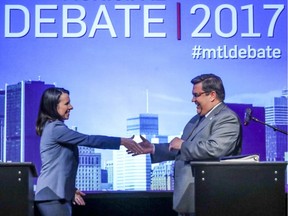 Denis Coderre, incumbent mayor, and Projet Montreal candidate Valerie Plante shake hands following English language debate in Montreal Oct. 23, 2017.