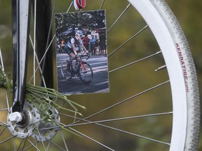 A picture of Clément Ouimet was added to his bike during the the ghost bike ceremony on Camillien-Houde Way in Montreal Oct. 25, 2017.