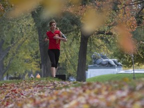 Mylene Blais runs on path near George Cartier monument on Mount-Royal on Tuesday October 24, 2017. (Pierre Obendrauf / MONTREAL GAZETTE)