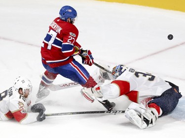 Montreal Canadiens Alex Galchenyuk shoots the puck over Florida Panthers James Reimer for a goal as Panthers defenceman Michael Matheson misses the stick check during second period of National Hockey League game in Montreal Tuesday October 24, 2017.