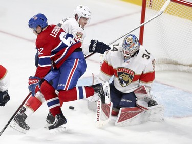 Montreal Canadiens Artturi Lehkonen jumps in front of Florida Panthers goalie James Reimer while being checked by Panthers defenceman Mark Pysyk during second period of National Hockey League game in Montreal Tuesday October 24, 2017.