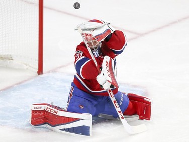 The puck deflects off trapper glove of Montreal Canadiens Carey Price during second period of National Hockey League game against the Florida Panthers in Montreal Tuesday October 24, 2017.