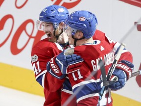 Montreal Canadiens Paul Byron, left, and Brendan Gallagher celebrate Gallagher's goal against the Florida Panthers during second period of National Hockey League game in Montreal Tuesday October 24, 2017.