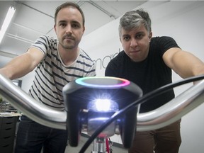 Co-founders Xavier Peich, left, and Gabriel Alberola with their SmartHalo: "We wanted to create not just a navigation device,” Alberola said. “For us, it’s a bike companion.”