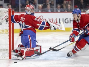 Canadiens goalie Carey Price slides across the crease and Brendan Gallagher pursues the puck Thursday night in Montreal.