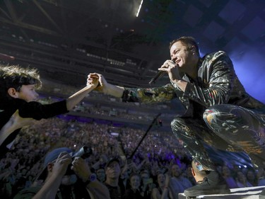 MONTREAL, QUE.: OCTOBER 27, 2017 -- Imagine Dragons singer Dan Reynolds reaches out to grab the hand of a young boy during concert at the Bell Centre in Montreal Friday October 27, 2017. (John Mahoney / MONTREAL GAZETTE) ORG XMIT: 59563 - 0417
John Mahoney, Montreal Gazette