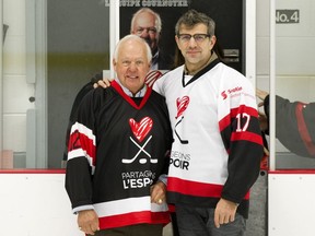 Hockey legend Yvan Cournoyer, left, and Montreal Canadiens general manager Marc Bergevin at the Share the Warmth charity hockey game in Pointe-Saint-Charles, Montreal, Saturday October 28, 2017. (Graham Hughes/Montreal Gazette)