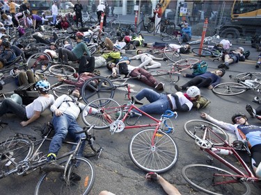The scene was stark at the Oct. 28, 2017 "die-in" and that was the idea. Cycling advocates want safer streets. "If (the city) continues to not do anything, people will continue dying,” Gabrielle Anctil said. (Christinne Muschi / MONTREAL GAZETTE)