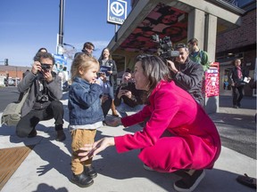 Projet Montréal leader Valerie Plante (right) meets three-year-old Ayma as she campaigns in Montreal, October 28, 2017.   (Christinne Muschi / MONTREAL GAZETTE)