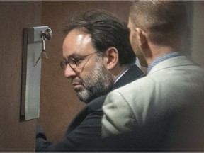 Tarek Mokdad, with glasses, arrives to give testimony as an expert in jihad and radical Islam during the trial of Sabrine Djermane and El Mahdi Jamali  on Tuesday, Oct. 31, 2017, in Montreal.