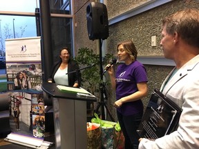 Francesca Corso, (centre), executive d director of Big Brothers Big Sisters of West Island, speaks as Brian Arnott (right), CEO of Traffic Tech, listens last Thursday in Kirkland.