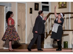 Elisa MacLeod as Marianne, Clive Brewer as Orgon and Christinna Filippidis as Dorine, right, during a scene from the Lakeshore Players Dorval's production of Molière's comedy Tartuffe.