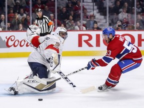 Victor Mete is stopped by Florida Panthers goalie Roberto Luongo during third-period action in Montreal on Friday, Sept. 29, 2017.