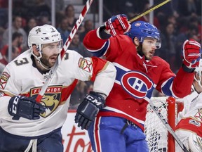 Montreal Canadiens' Alex Galchenyuk gets shoved by Florida Panthers' Keith Yandle during third period in Montreal on Friday, September 29, 2017.